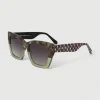 Gafa con tendencia a cat eye verde jaspeado, verde semitransparente y estampado