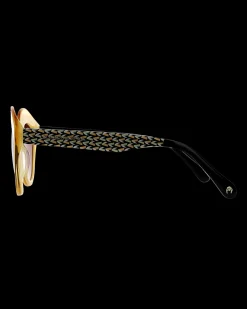 Gafa con tendencia a cat eye mostaza con estampado de hojas